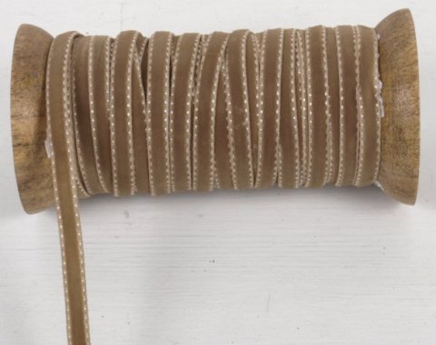 Samtband, Sand, Holzrolle