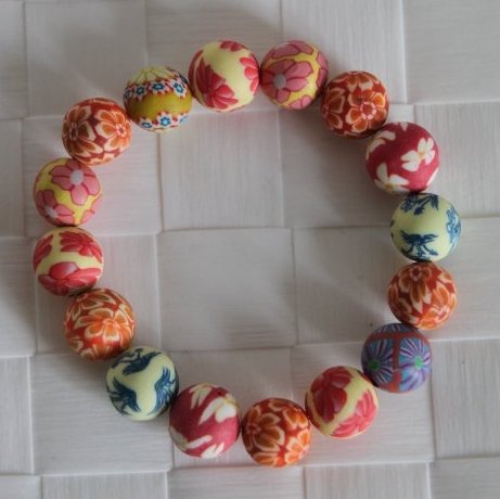 Fimo armbnd gul og orange m. 12 mm perler