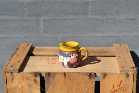 Milkjar with cow