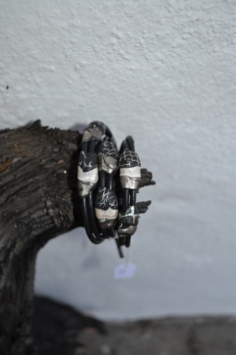 Handmade heavy leatherbracelet in silver and black colours