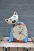 Cat figure with a clock