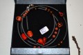 Bracelet with glassbeads on rubberchain