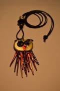 Necklace with an owl in gold and orange/red colours