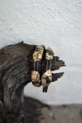 Handmade leatherbracelet in golden colours