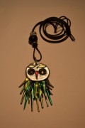 Necklace with an owl in silver and green colours